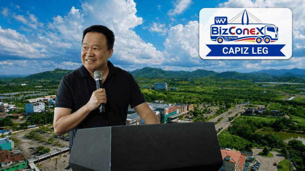 Jose Nery “Bub” Ong speaks at the WV BizConEx on Wheels Capiz Leg, with Pueblo de Panay Township in Roxas City in the background.
